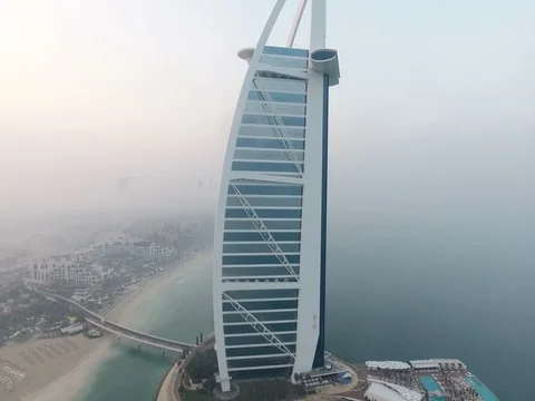 Aerial view of Burj al Arab hotel at sunrise. Stock Footage