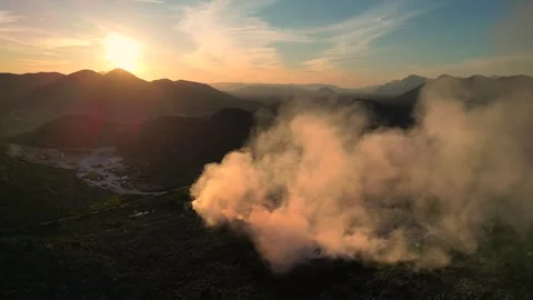 Aerial view of burning garbage dump pollution at sunset Vídeo Stock 346243378