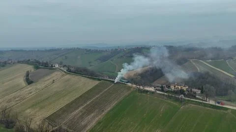 Aerial View of Burning Grapevine Branches and Smoke Rising Over the Rolling Fotos Stock