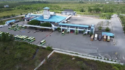 Aerial view of buses queuing to load passengers at a bus terminal Stock Footage 326200088