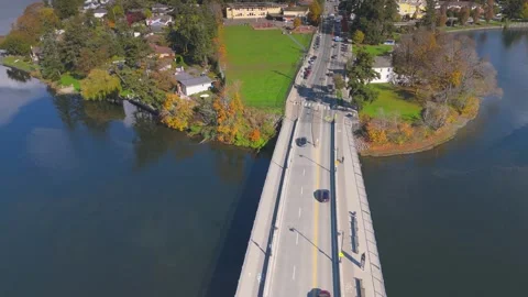 Aerial view of a bustling bridge over a serene river in Victoria, BC, Canada Stock Footage 292835490