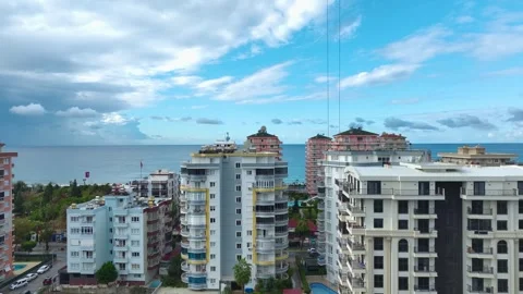 Aerial View: A bustling construction site highlights workers preparing for Stock Footage 296043220