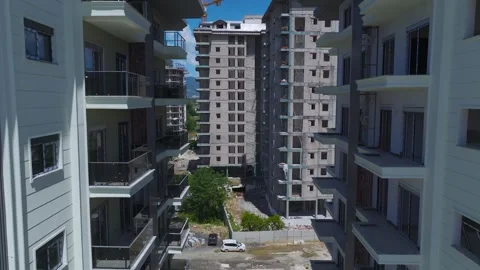 Aerial View: The bustling construction zone in Mahmutlar transforms the district Stock Footage 296086374