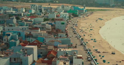 Aerial view of the bustling Mui Ne fishing village in Vietnam, at sunset Stock Footage 342469918