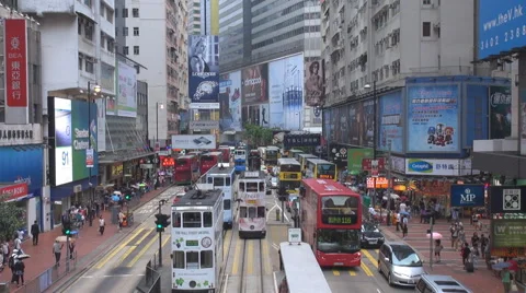 Aerial view bustling street traffic Hong Kong tramway tram pass asian lifestyle  Stock Footage