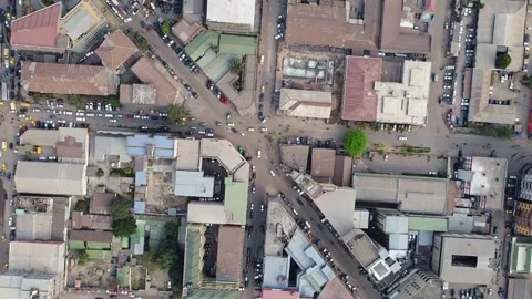 Aerial view of a bustling urban intersection with dense buildings and traffic Vídeos de archivo 317933438