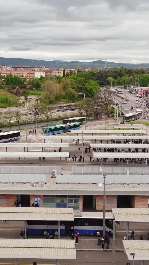 Aerial view of busy bus platforms at Verona Porta Nuova station in spring Stock Footage 309567115