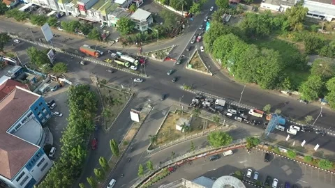 Aerial View of Busy City Intersection with Flowing Traffic Stock Footage 274958446