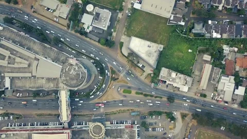 Aerial View of a Busy City Intersection with Surrounding Buildings and Park.. Stock Footage 295743963