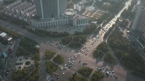 Aerial view of busy city intersection at sunrise. Stock Footage 335710439