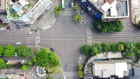 Aerial view of busy city intersection with traffic and pedestrians. Stock Footage 336319041