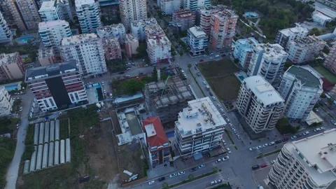 Aerial View: A busy construction site shows workers pouring concrete and Stock Footage 296071402