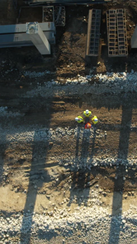 Aerial view of a busy construction site with workers using tablets Stock Footage 319614110