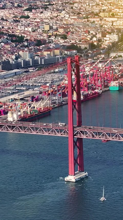 Aerial view of a busy container terminal and bridge in Lisbon Vidéo 343864439