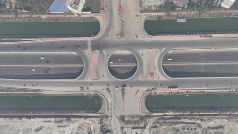 Aerial view of a busy highway interchange with multiple roads and waterways Stock Footage 328729084