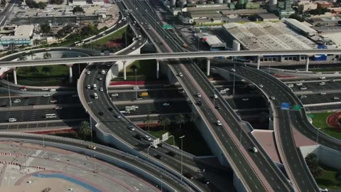 Aerial view on a busy highway intersection with lots of traffic, Dubai, UAE, 4k Stockbeeldmateriaal 151931672