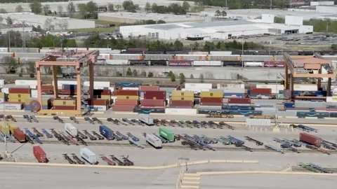 Aerial view of busy intermodal freight terminal operations with cranes movi.. Stock Footage 337282380