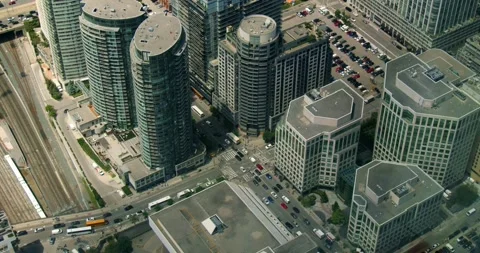 Aerial view of a busy intersection between glass skyscrapers in Toronto, Canada Stock Footage 278181323