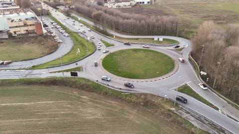 Aerial view of a busy roundabout intersection on a cloudy day in Italy Stock Photos