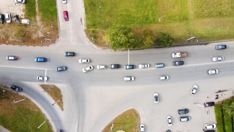 Aerial view of a busy suburban intersection with moving cars. Stock Footage 154353971
