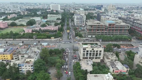 Aerial view of busy traffic intersection and cityscape in Indore 動画素材 333161037