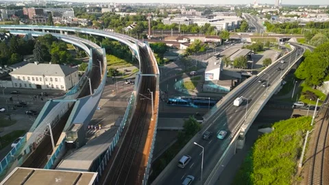 Aerial view of a busy urban intersection with multiple elevated roads and v.. Stock Footage 311643858