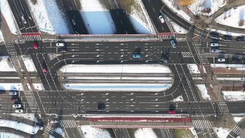 Aerial view of busy urban intersection with multiple lanes, vehicles in motion Stock Footage 347789003