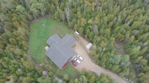 Aerial view of a cabin in the forest Stock Footage 143211761