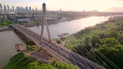 Aerial view of the cable bridge in the sunset with city on the background, 4k Stock Footage 200876436