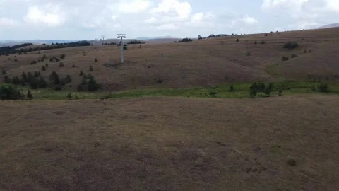 Aerial View of Cable Car Over a Mountainous Pathway Stock Footage 289221735