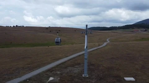 Aerial View of Cable Car Over a Mountainous Pathway Stock Footage 289221824