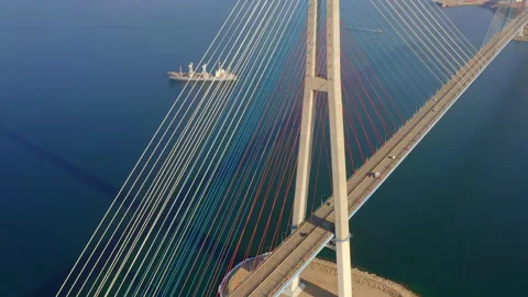 Aerial view of the cable-stayed bridge bridge over the strait Stock Footage 229483492