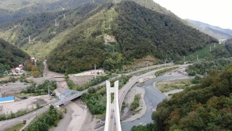 Aerial view of cable-stayed bridge on the road to Krasnaya Polyana Stock Footage 321379925