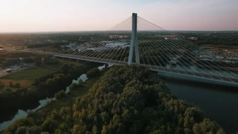 Aerial View of Cable Stayed Bridge Over River at Sunset Stock Footage 344744618