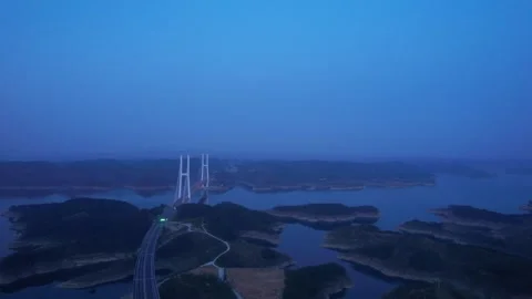 Aerial view of a cable stayed bridge over Danjiangkou Reservoir at twilight Video stock 347046674
