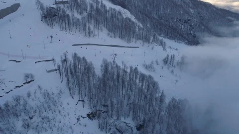 Aerial view cableway in winter forest with clouds Stock Footage 103475047