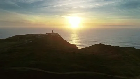 Aerial view of Cabo da Roca lighthouse at sunset in Portugal. Stock Footage 344993086