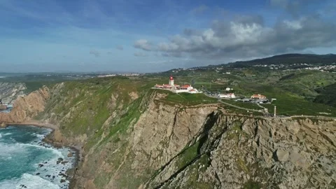 Aerial view of Cabo da Roca lighthouse on rugged cliffs, Portugal. Stock Footage 344993142