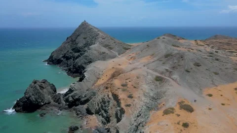 Aerial view of Cabo de la Vela with sandy hills under blue sky Stock Footage 330380447