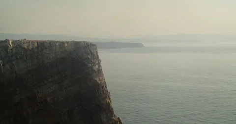 Aerial View of Cabo Peñas Cliffs at Sunset Coastline in Asturias, Spain Stock Footage 341433420