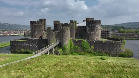 Aerial view of Caerphilly Castle and surrounding landscape on a bright day, Stock Footage 287729888