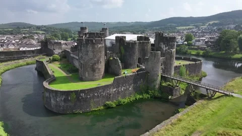 Aerial view of Caerphilly Castle and surrounding landscape on a bright day, Stock Footage 287730119