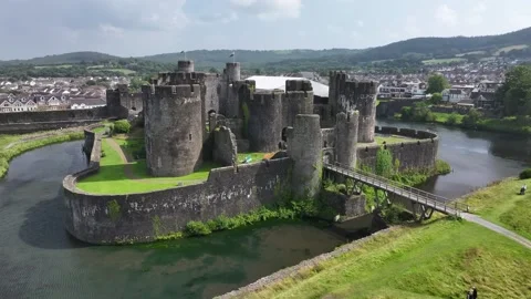 Aerial view of Caerphilly Castle and surrounding landscape on a bright day, Video stock 287730120