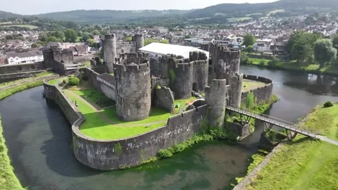 Aerial view of Caerphilly Castle and surrounding landscape on a bright day, Stock Footage 287730368