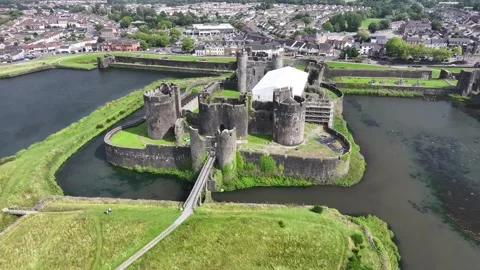 Aerial view of Caerphilly Castle and surrounding landscape on a bright day, Stock Footage 287730775