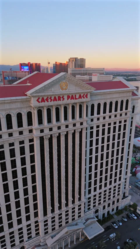 Aerial view Caesars Palace facade at sunset golden hour Las Vegas Nevada Stock Footage 325776904