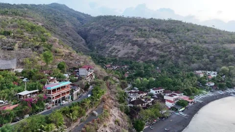 Aerial view of a caffe, ocean and volcano in Amed, Bali Stock Footage 316194590