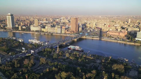 Aerial view of Cairo at sunset. River Nile and city skyilne. Stock Footage 129607343