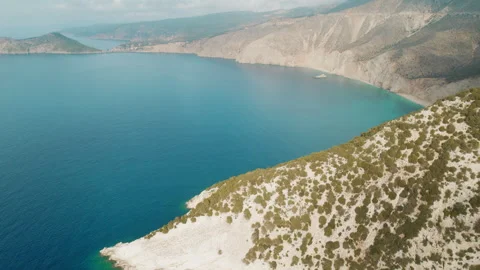 Aerial view of calm blue bay by rocky hills in Kefalonia Ionian Island Greece Stock Footage 344913355