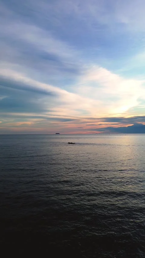 Aerial View of Calm Ocean at Sunset Stock Footage 311294435